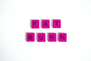 Fat Burn spelled out with pink scrabble pieces. 